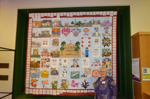 Glendale, Arizona quilter Diane McElmury with her quilt "A Tribute To Arizona's Amazing Women."