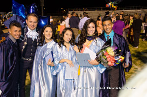 A group of 2014 Mariachi Aztlán de Pueblo High School graduates with director John Contreras following graduation.